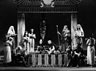 Curt Dawson (Apollodorus) seated left: Yolande Bavan (Cleopatra ) and Alun Thomas (Caesar) centre: Ian McKellen (Major Domo) standing with staff and padding.