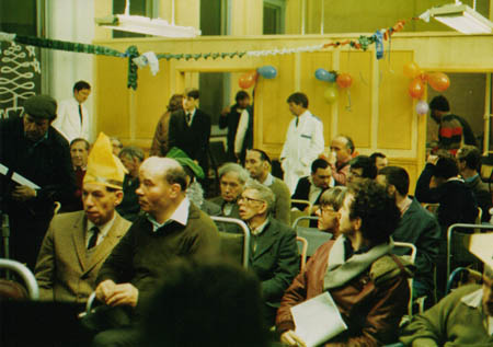 Jim Broadbent (white-coated nurse on the rear left) oversees Walter (Ian McKellen, front
left seated) and his companion (in real life an injured ex-boxer) in the mental hospital
during their Christmas party