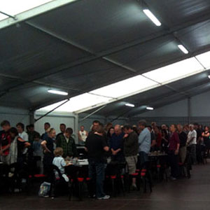 A moment of silence for Christchurch earthquake victims, in the food tent at Stone Street Studios, 7 March 2011