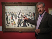 Ian McKellen with <em>The Cripples</em> by LS Lowry