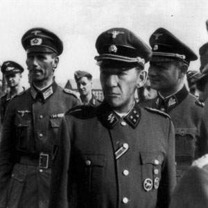 <I>This collage substitutes my face for Heinrich Himmlers, inspecting actual inmates of a Nazi labour camp.</I>