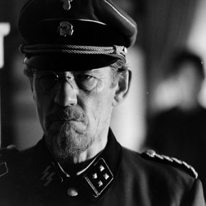 <I>Todd supplies Dussander with a fancy-dress Nazi costume and revives the old mans latent violence by forcing him to march up and down his kitchen.  I did the routine a half-dozen times on film - the sinister panic of the finished scene, depends mainly for its effect on the music and film-editing of John Ottman.</I>
