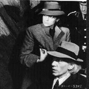 Medieval historian Ian McKellen (right) and his daughter Alberta Watson are dragged out of a detention camp by Nazi officer Gabriel Byrne in Paramount Pictures enchanting and horrifying fable, The Keep.