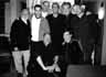 Front row: Host Greg Gorman, Gus Van Sant.  Rear: John Schlesinger, Bryan Singer, John Waters, Randall Kleiser, Ian McKellen, David Hockney