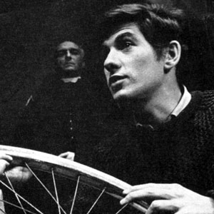 1964, A SCENT OF FLOWERS: Jennifer Hilary as Zoe watches unseeingly as her stepbrother Godfrey (Ian McKellen) mends a puncture. In the background, the Priest is played by Peter Howell  