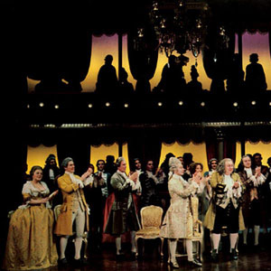 Nicholas Kepros (centre; Emperor Joseph II) welcomes Tim Curry (Mozart) to court. Ian McKellen (Salieri) applauds stage right.