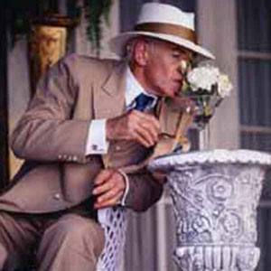 James Whale (Ian McKellen) smells the flowers at George Cukors garden party