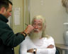 Rick applies Gandalf the Whites make-up under the slopes of Mount Ruapehu, the live volcano, the appropriate setting for the explosive battles of The Two Towers. These scenes were shot only days after shooting Gandalfs entrance into Hobbiton at the beginning of the first movie, May 2000.
