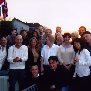 2002, X2: Party at McKellens Point Grey Road: (L to R) Front kneeling: Mike Dougherty, Tom DeSanto; Standing: ?, Patrick Stewart, Nicole Cox, ?, Brian Cox, ?, ?, Tom Siegel; Second Row: ?, Jesse Platte, Debra and Hugh Jackman; Back Row: Elliot, Dan Harris, ?, John Ottman, Ian McKellen  - Photo by Steve Thompson