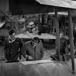 <BR><BR><I>This reproduction bi-plane couldn�t fly.  As it taxied, with the aid of hidden ropes, across the alp,  I was Colonel Peck�s assistant onboard. </I>
