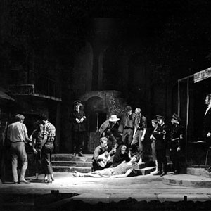 1958, CAMINO REAL: Garry O�Connor plays the guitar, Ian McKellen dies, tall Simon Relph watches and Richard Cottrell, sitting, plays out front in Camino Real, ADC 1958  - Photo by Edward Leigh