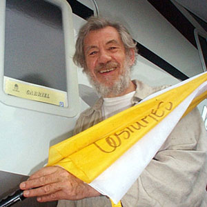 2004, NEVERWAS: Ian McKellen (Gabriel) outside his dressing room trailer with a purloined umbrella, Vancouver, October  - Photo by Keith Stern