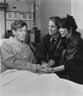 <I>Matthew Modine and Lily Tomlin bedside me in the working hospital where we filmed, with a number of actual AIDS patients in adjacent beds</I>