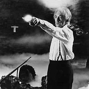 Surrounded by its dead victims, the monster arm stretches out to greet Cuza (Ian McKellen)