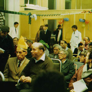 Jim Broadbent (white-coated nurse on the rear left) oversees Walter (Ian McKellen, front left seated) and his companion (in real life an injured ex-boxer) in the mental hospital during their Christmas party.