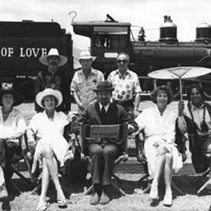 L to R: Marizio Meru, Penelope Keith, Janet Suzman, Stanley Seger, Christopher Miles, Ian McKellen, Andrew Donnally, Ava Gardner, Jorge Riveras
<BR><BR><I>The steam-train had been brought out of retirement and, for this publicity shot, re-named</I>