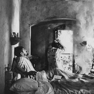 The Lawrences� bed-time disturbed by a Mexican earthquake
<BR><BR><I>Such effects take a long time to set up and this one was so complicated it could only be filmed once by the three cameras shooting simultaneously.  Janet and I were to sit up in bed and on cue react to the quake�s rumble as cracks appeared in the wall.  Under the bed stage-hands shook its frame as plaster and debris fell from the mock ceiling.  At last this one-off shot was ready for action � everything went according to plan until the last moment when I had to leap from the bed to safety.  As I pulled back the bedclothes they revealed my lighter, the gold packet of 20 Benson and Hedges cigarettes and my half-finished crossword in the previous morning�s copy of the London Times newspaper!