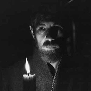 Lawrence (Ian McKellen) off to bed
<BR><BR><I>This scene showed me candlelit moving round the marital bed � in shadow I displayed the first erection ever seen in a mainstream movie.  This was achieved with a dildo and a great deal of sticking-plaster.</I>
