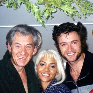 1999, X-MEN: Ian McKellen (Magneto), Halle Berry (Storm), and Hugh Jackman (Wolverine) take a Christmassy break in the makeup trailer, Toronto  